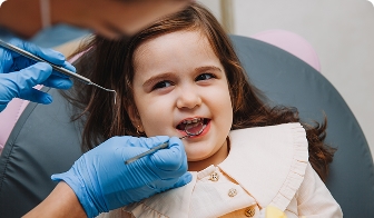 Child's back molars being checked