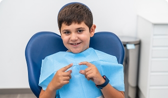 Child with a gap from a lost baby tooth