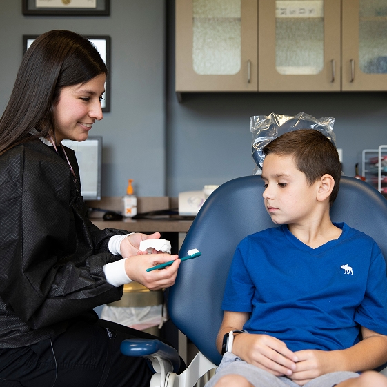 Pediatric dentist greeting a new patient