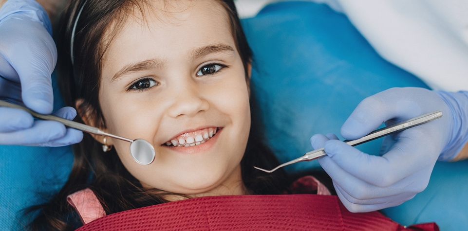 Child receiving dental treatment