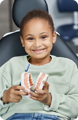 A child smiling during a pediatric dental appointment