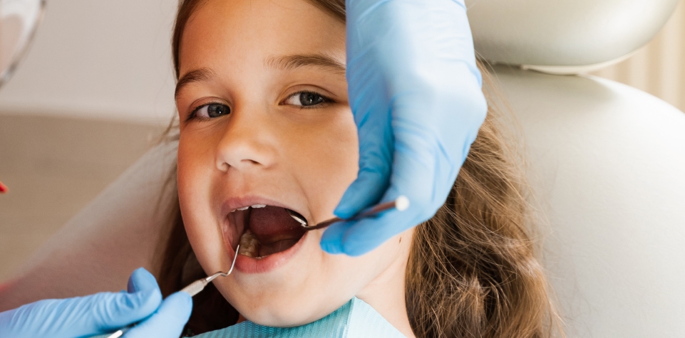 Child receiving dental treatment