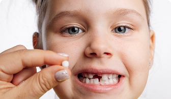 Child showing a restored tooth