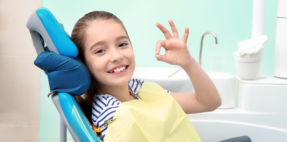 Child receiving dental treatment