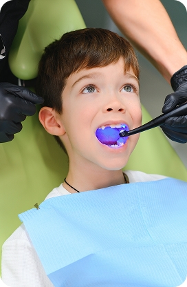 A child smiling during a pediatric dental appointment