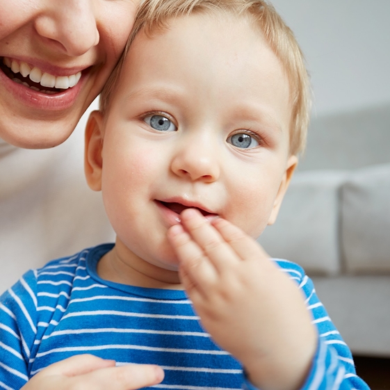 Dentist teaching a child about dental care