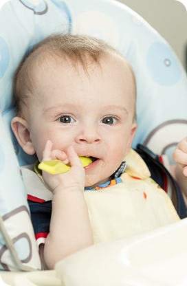 Infant having new teeth checked at a dental visit