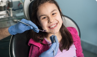 Child receiving a dental filling