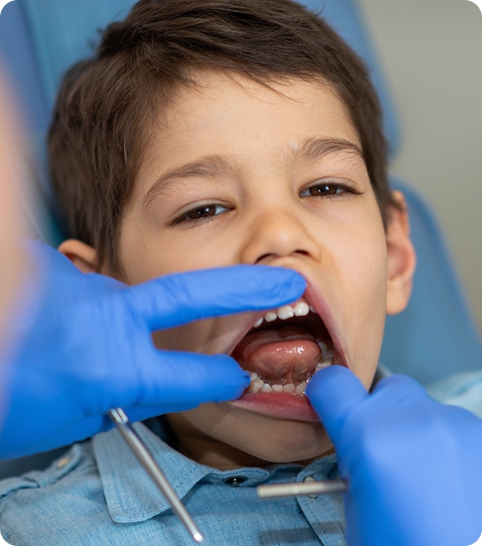 Pediatric dentist reviewing an X-ray with a parent