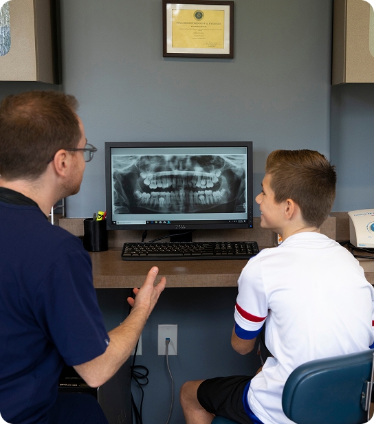 Pediatric dentist evaluating a child's bite development