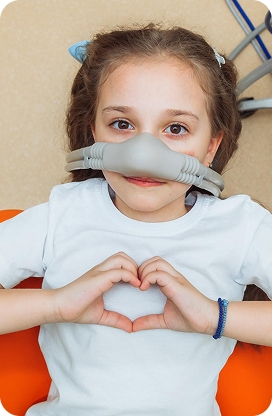 A child smiling during a pediatric dental appointment