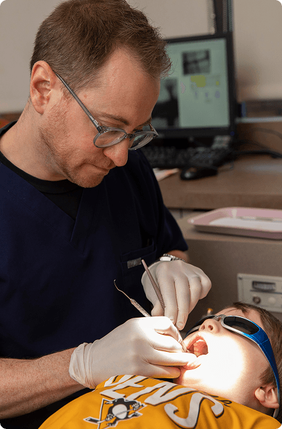 A child receiving a dental crown at Big Picture Pediatric Dentistry