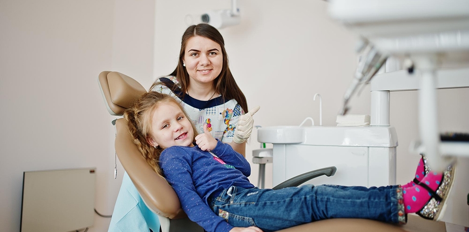 Child receiving dental treatment