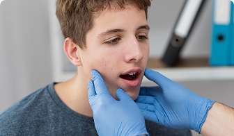 Teen having wisdom teeth monitored