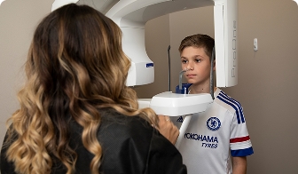 Teenager wearing clear aligners