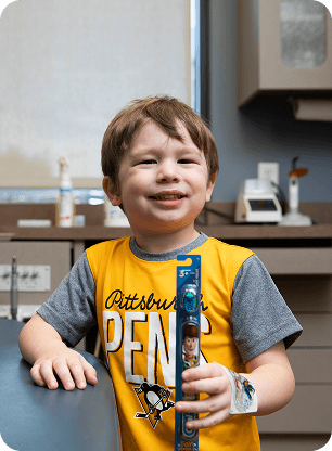 Child having a tooth examined